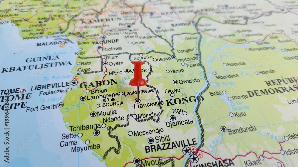 Naklejka premium View of Franceville, is one of the four largest cities in Gabon, west africa, on a geographical map of Africa, marked with red push pin