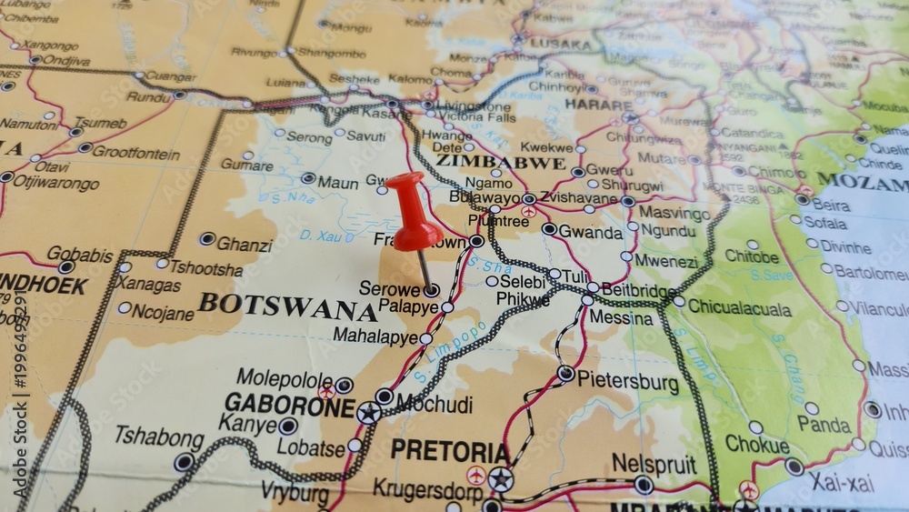 Naklejka premium View of Serowe, is an urban village in Botswana's Central District, on a geographical map of Africa, marked with red push pin