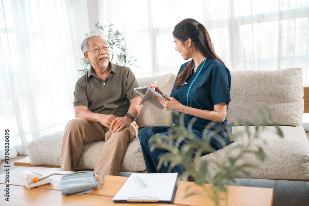 Fototapeta premium Elderly health insurance, elderly man nurse consultation living room patient healthcare care sofa home assessment