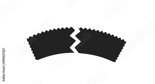 Broken black gear with jagged edges.