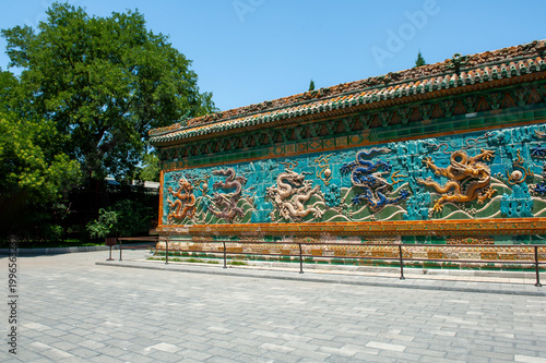 Beijing Beihai Park's Nine-Dragon Wall was built in the 21st year of the Qianlong reign of the Qing Dynasty (1756). It is a colored glazed brick shadow wall in a wooden structure imitation style.