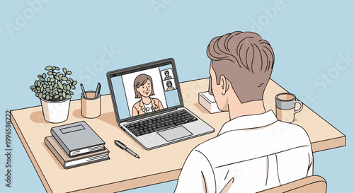 Man attending video conference on laptop computer at desk
