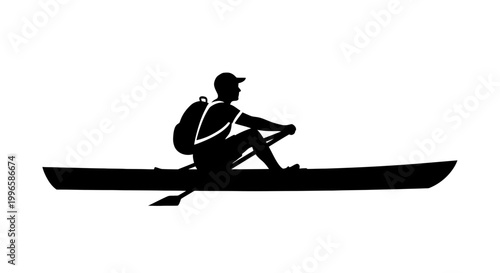 Silhouette of Man Paddling Canoe Solo.