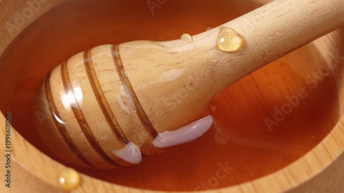 Fresh honey from the forest in a container.