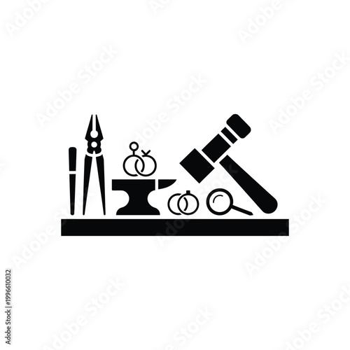 Black silhouette of jewelry making tools and jewelry on a workbench anvil hammer