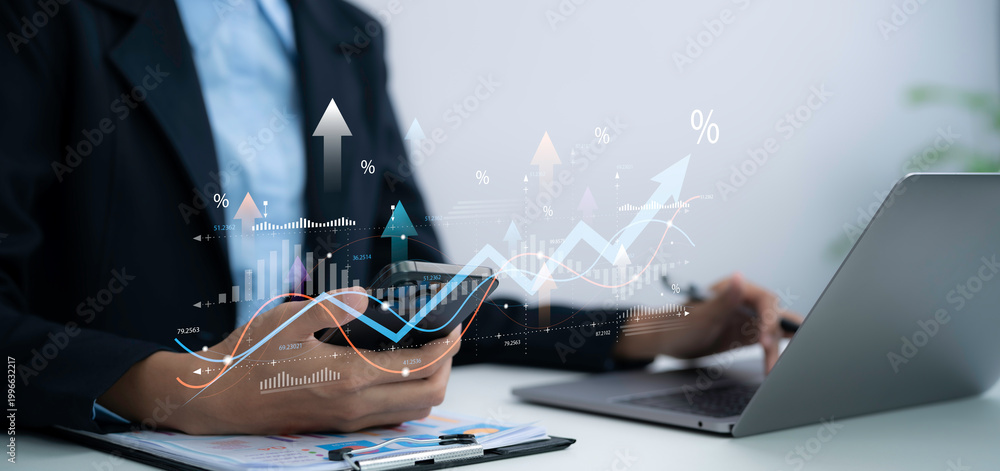 Obraz premium Business professional analyzes tax VAT data on smartphone and laptop in office using financial charts for accounting compliance reporting and digital finance management strategy