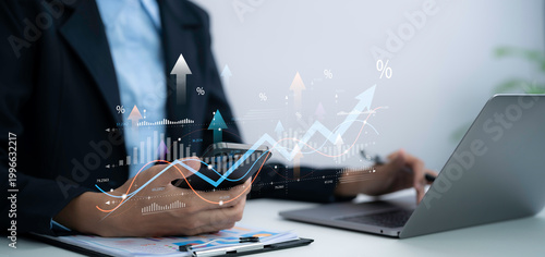 Business professional analyzes tax VAT data on smartphone and laptop in office using financial charts for accounting compliance reporting and digital finance management strategy