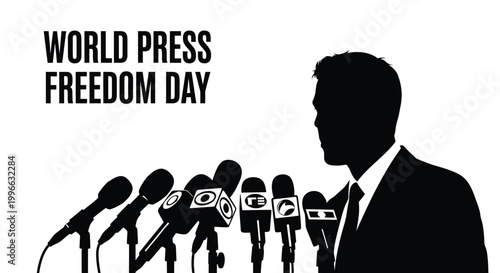 Silhouette of a male spokesperson standing behind many microphones to address the global media news event
