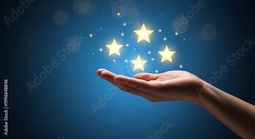 Hand holding glowing stars on a blue background