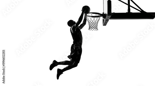 Silhouette of a basketball player dunking a ball into the hoop