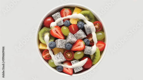 Fresh fruit salad with yogurt sauce in a white bowl on light background