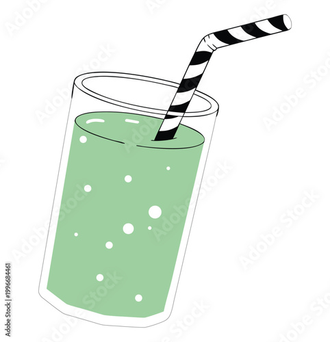 Green smoothie in glass with striped straw