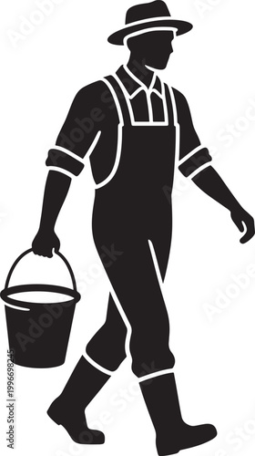 Black silhouette of a man in overalls and hat carrying a bucket
