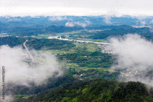 Photography A high angle panoramic view of the lush green mountains surrounding Huizhou Anci