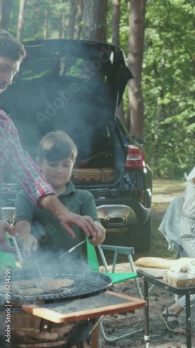 Cooking together during summer family outing, Enjoying warm summer day with outdoor cooking and family fun in nature