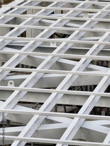 Close-up of white steel roof structure under construction