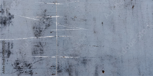 Weathered snow covered concrete wall and old fence with a dirty gray grunge texture on a rough aged cement surface