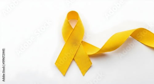 Yellow ribbon symbol of support and awareness on white background