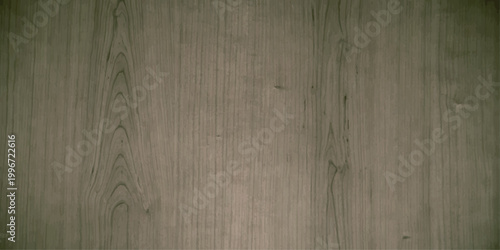 An aged brown grunge wood texture background features a rough vintage surface of dark wooden boards with a distressed timber pattern on an antique weathered wall