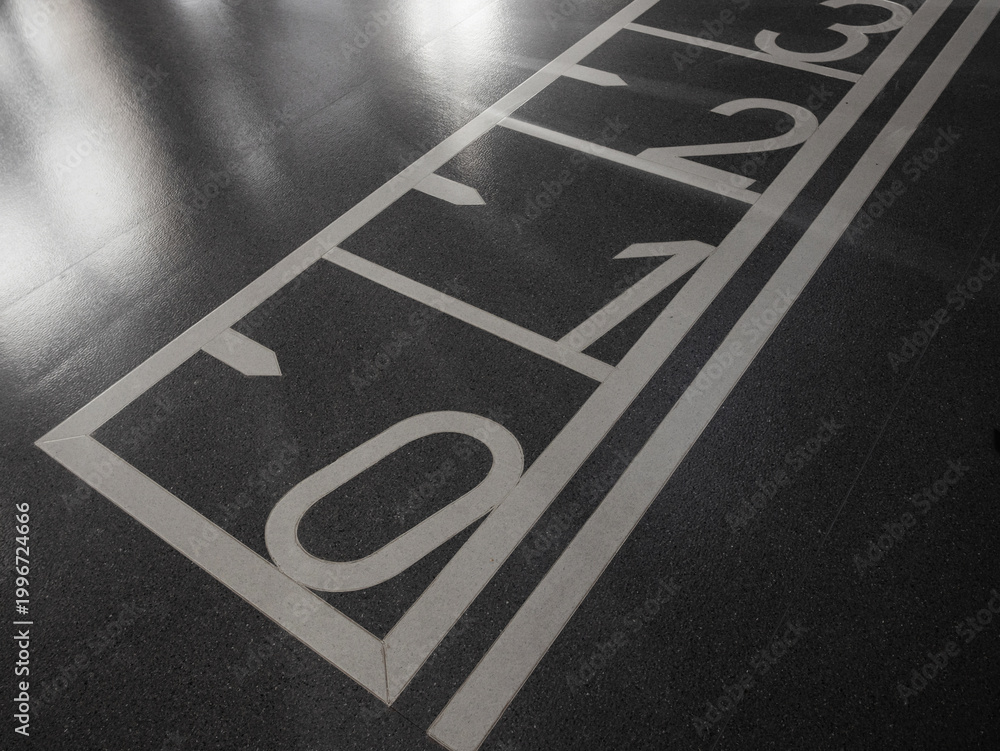 Fototapeta premium Agility ladder markings on gym floor for speed and footwork training drills