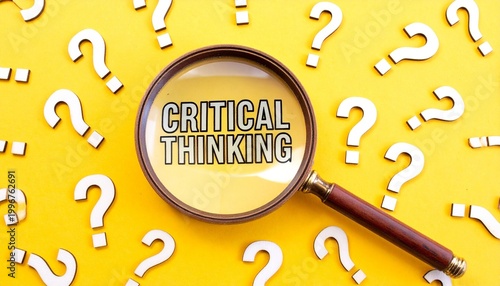 Magnifying glass highlighting critical thinking text