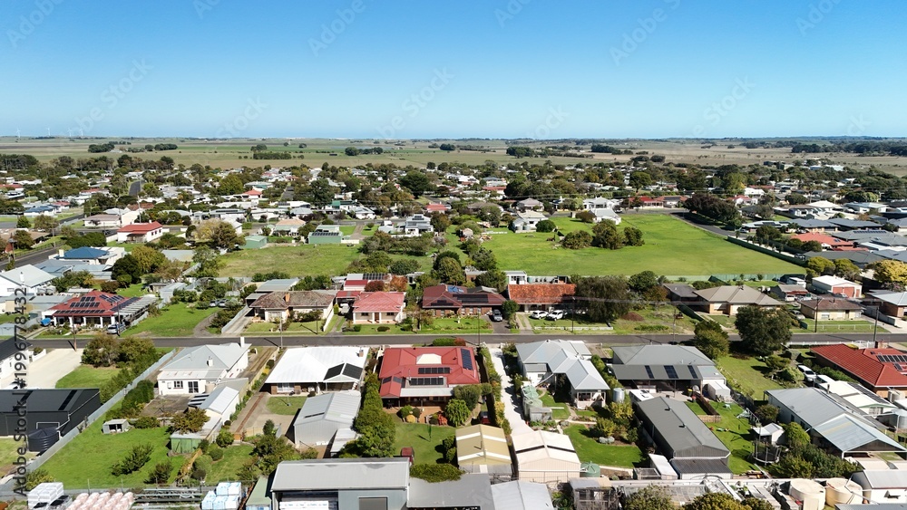 Fototapeta premium Millicent, South Australia: 4K aerial drone image of Rotunda Parklands, residential houses, estates, streets, traffic and regional town landscape