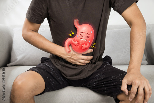A man sits gripping his abdomen as a cartoon stomach shows pain, illustrating gastritis, acid reflux, and digestive issues linked to stress, diet, and modern lifestyle habits in daily life