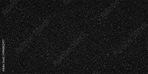 A textured, dark, black surface, revealing subtle details and creating a sense of depth and tactile.