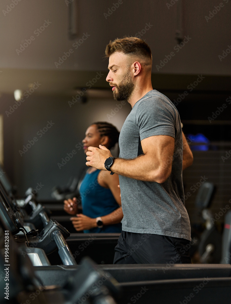 Fototapeta premium Portrait of a young man and a black woman exercising in a gym, running using thereadmill machine equipment, healthy lifestyle and cardio exercise at fitness club concepts