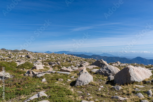 Rocky mountain landscape under clear blue sky in Corsica