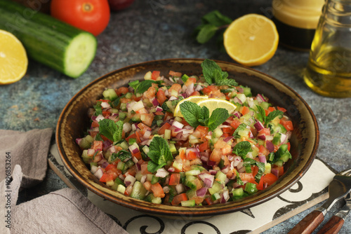A bowl of Shirazi salad, traditional dish of Iran, in rustic style