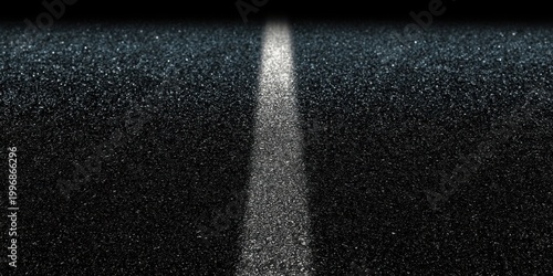 Single painted center line on dark asphalt road at night