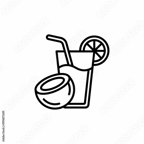 Coconut cocktail with straw and lemon.