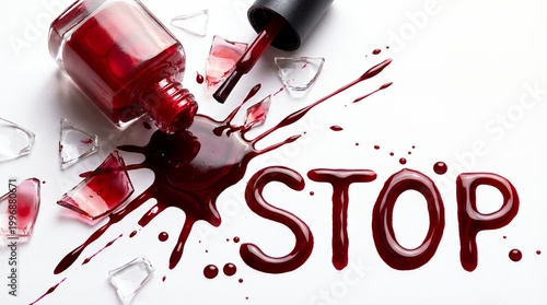 A spilled bottle of red nail polish forms the word STOP next to shattered glass fragments suggesting a chaotic or dramatic moment broken chaos accident danger warning crisis