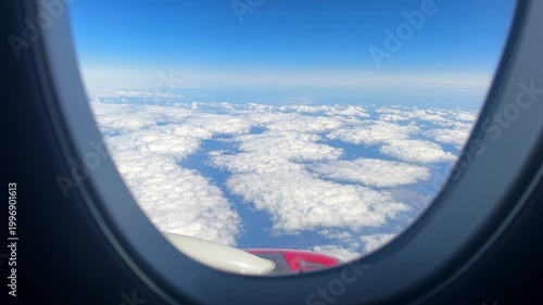 Textured Cloud Panorama Below Through Airplane Window With Wingtip, Patchwork Cloud Formations, Crisp Horizon, Highaltitude Clarity, Contemplative Atmosphere, Aerial Travel Perspective.