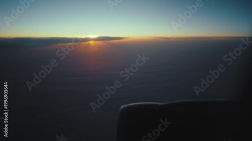 Sunset Cabin Scene. Reflected Oranges In Peaceful Evening Landscape. Calm Travel Ambiance With Sunset Glow And Wing Shadows. Serene Journey Moment Captured With Warm Hues And Expansive Horizon View