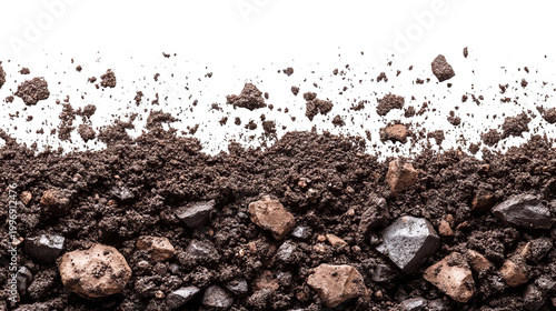 Close-up of dark, rich soil with scattered rocks and pebbles against a black background