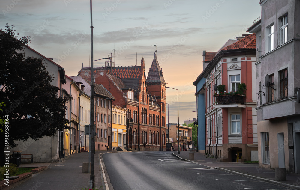 Obraz premium Street scene with local buildings, trees and roadway in Wałcz, West Pomeranian Voivodeship, Poland.