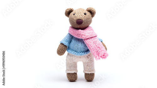 Adorable brown teddy bear doll in blue sweater pink scarf and white pants