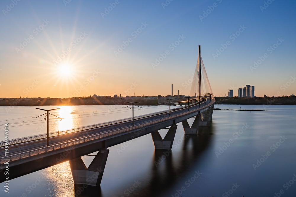 Fototapeta Kruunuvuorensilta bridge at sunset, the longest bridge in Finland, Helsinki