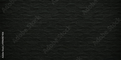 Textured dark gray brick wall, evoking a sense of depth and rustic elegance. The rough surface and dark tones create a compelling visual. 