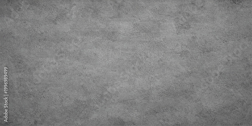 Textured concrete background in gray tones, a weathered, rough surface with a subtle industrial vibe. A seamless pattern perfect for adding depth to design projects.