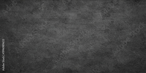 Dark, textured backdrop evoking a sense of raw, industrial aesthetic. The coarse surface provides a foundation for design concepts.