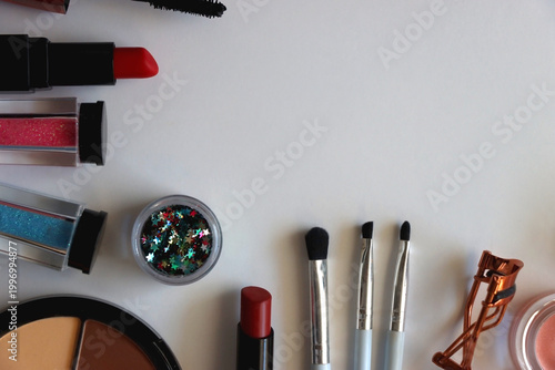 Various colorful cosmetic products on white background. Flat lay.