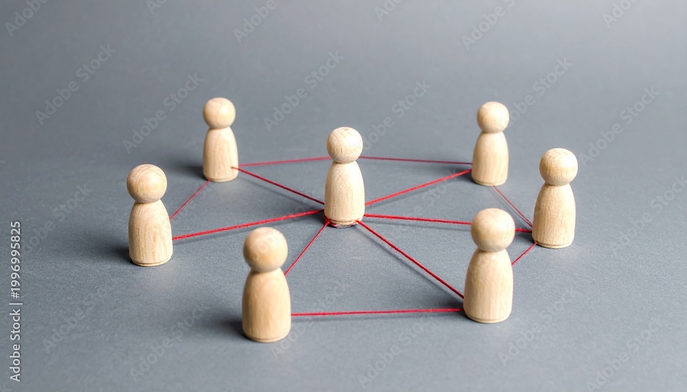 Obraz premium Central figurine connected by red strings.