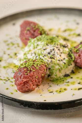 Authentic Italian appetizer platter featuring a selection of cured meats and artisanal cheese.