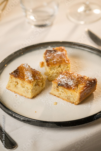 Traditional Pastiera Napoletana cake served on a rustic restaurant table