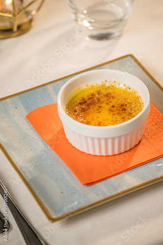Elegant presentation of a classic Italian dessert served in a fine dining setting. The image captures the rich textures, delicate plating, and appetizing details of an artisanal sweet treat