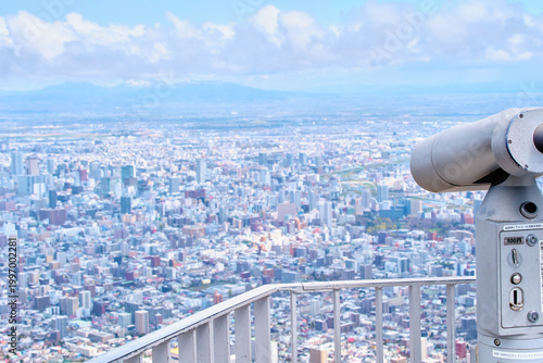 Bild auf Leinwand 藻岩山展望台のコイン式望遠鏡と札幌の街並み Coin-operated telescope at Mt