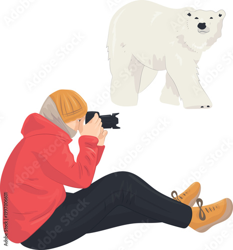 A photographer in winter clothing kneels, camera pointed at a wild animal: a polar bear – World Photography Day